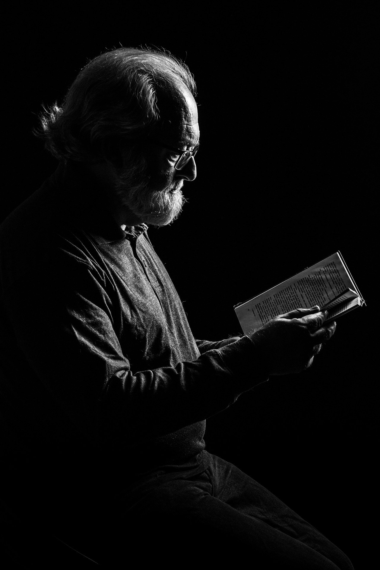 man reading a thriller